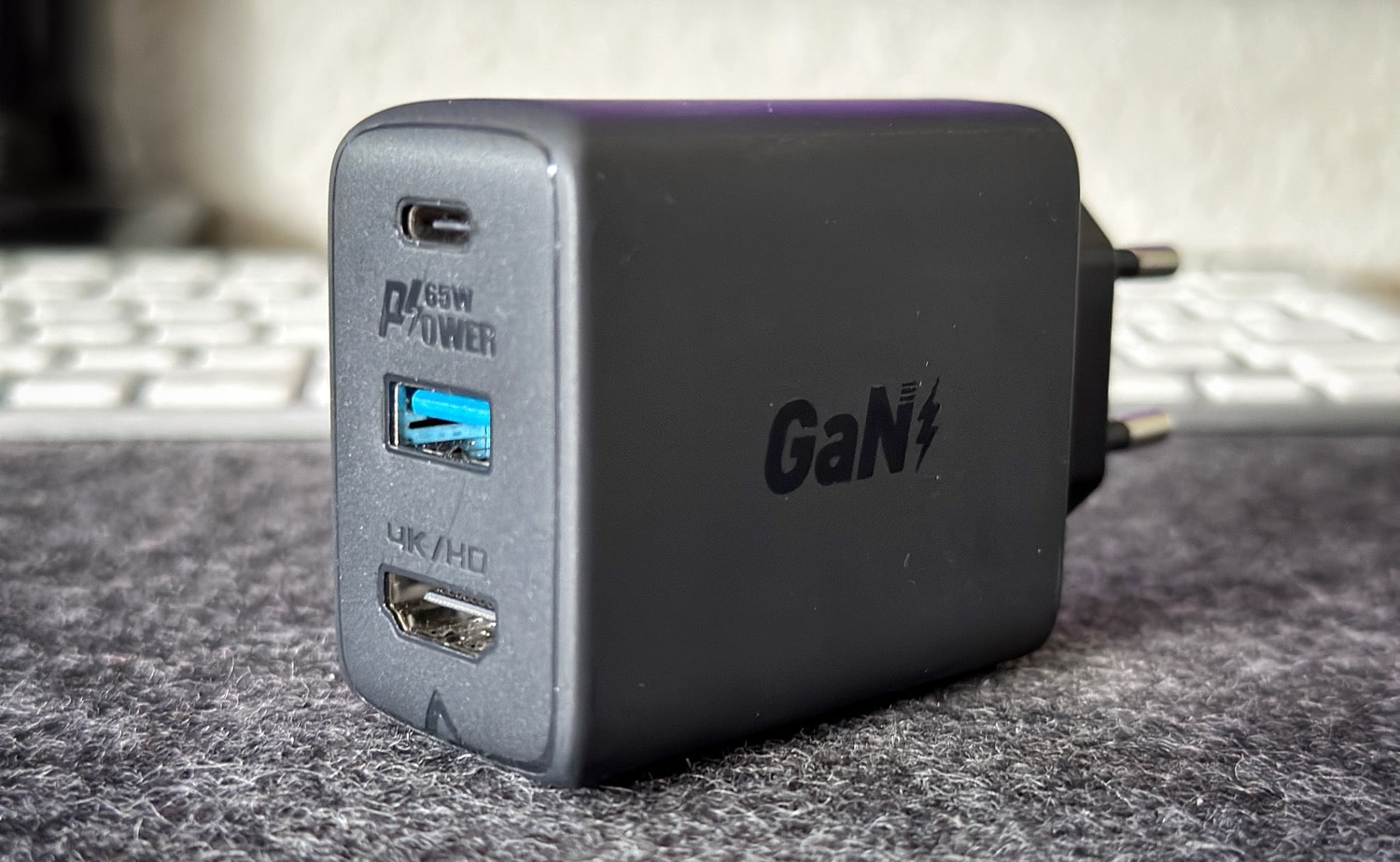 Acefast GaN 65W charger on a desk