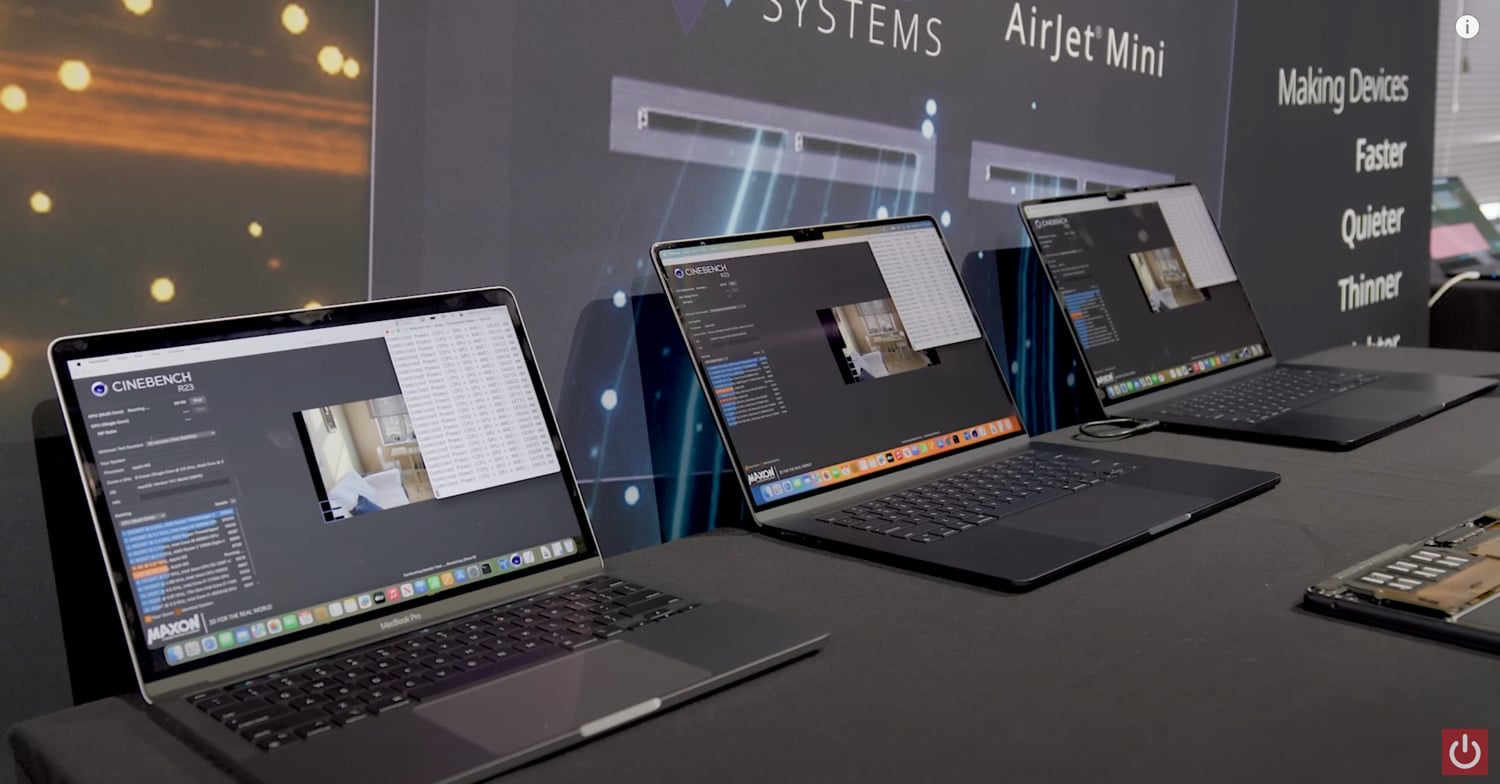 Frore Systems AirJet auf einem Messestand mit drei aufgereihten MacBooks