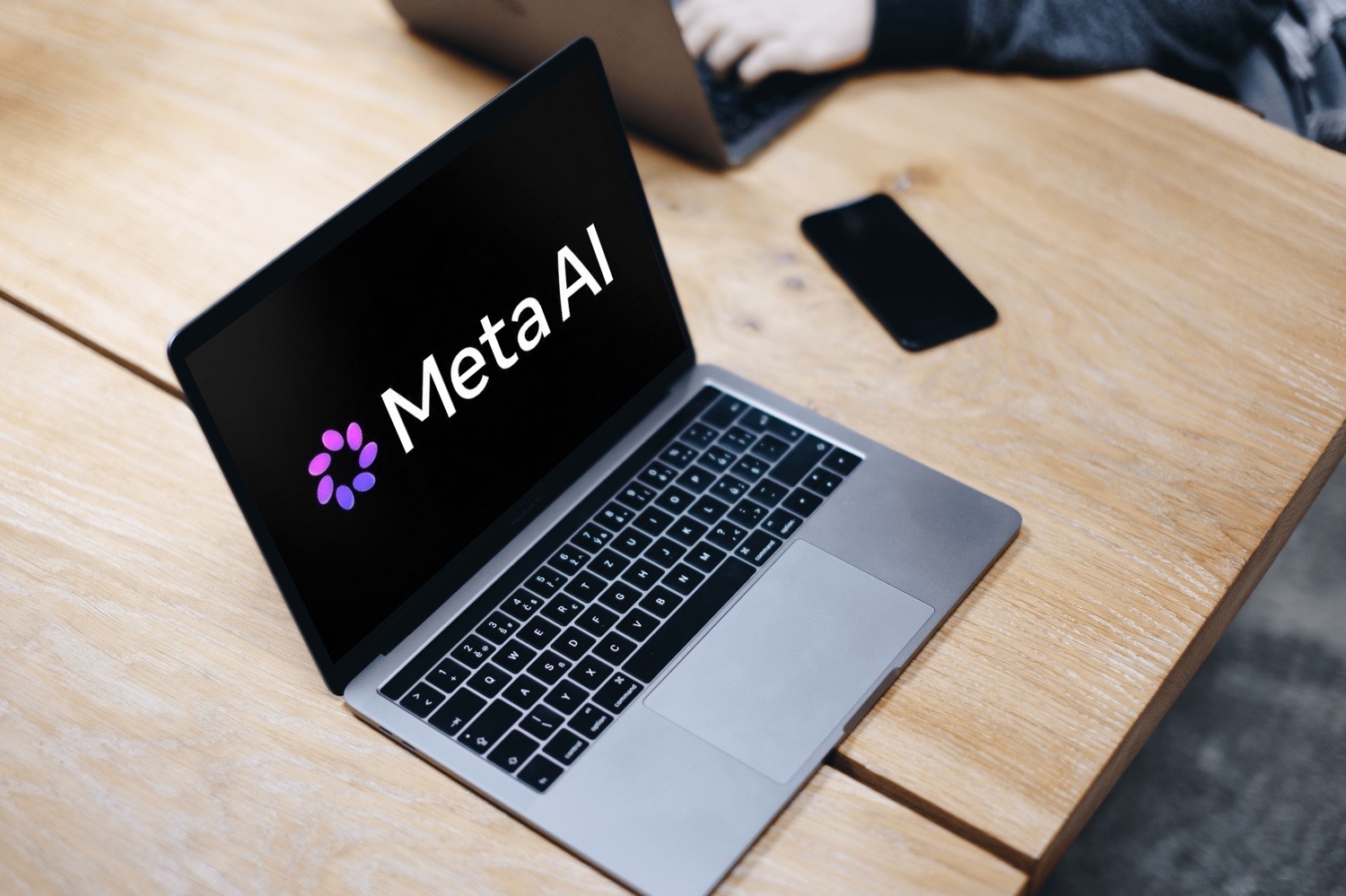 Meta AI-Logo auf einem MacBook-Screen